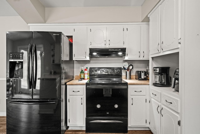 kitchen with dark wood-type flooring, black appliances, and white cabinets