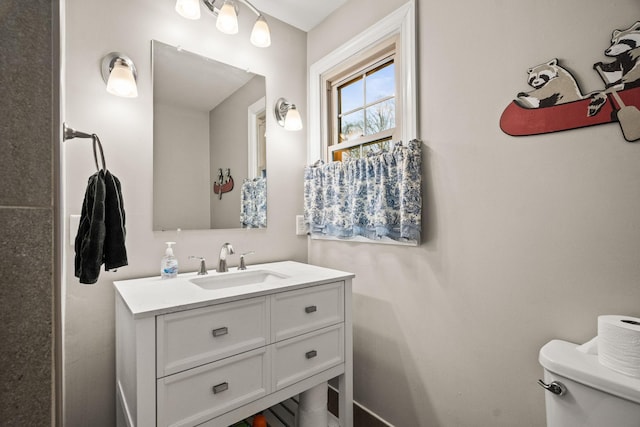 bathroom with vanity and toilet