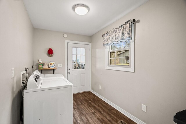 laundry area featuring dark wood-type flooring and washing machine and dryer