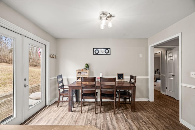 dining space featuring french doors and hardwood / wood-style floors