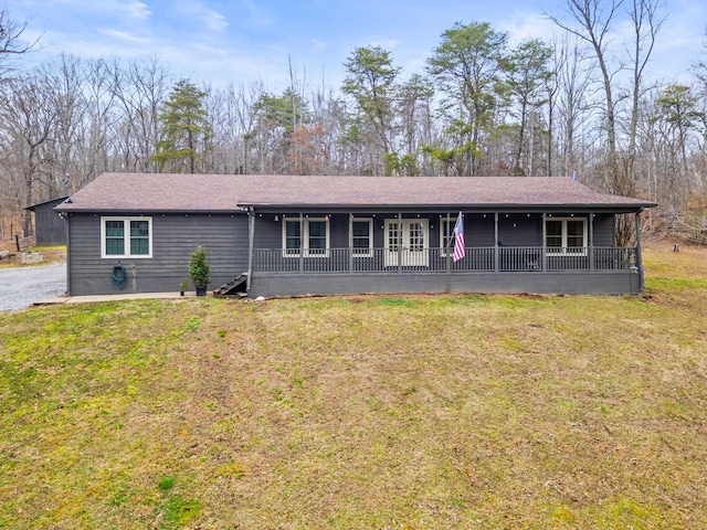 single story home featuring a front lawn and covered porch