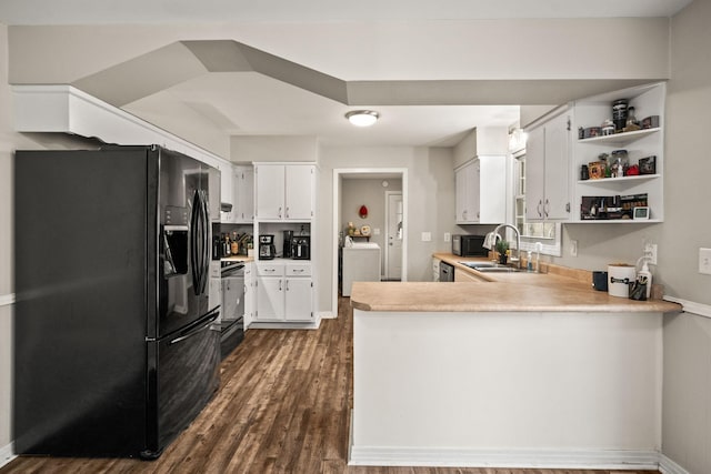 kitchen featuring sink, white cabinetry, stove, black refrigerator with ice dispenser, and kitchen peninsula