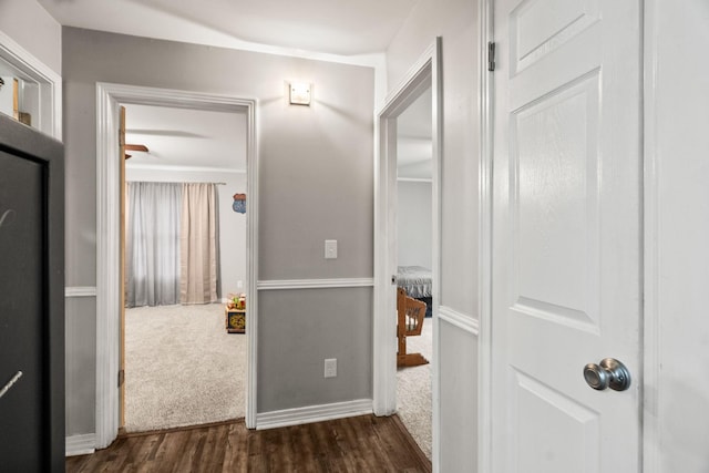 hall with dark hardwood / wood-style floors