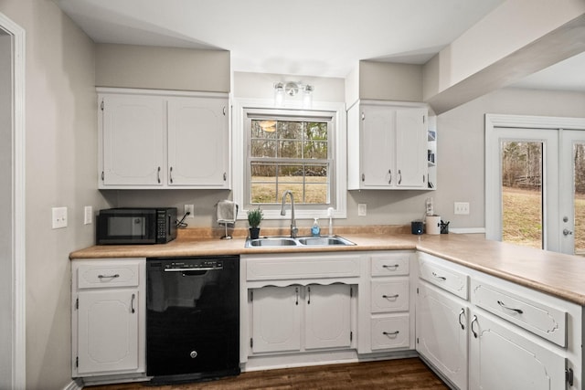 kitchen featuring white cabinetry, dark hardwood / wood-style flooring, sink, and black appliances