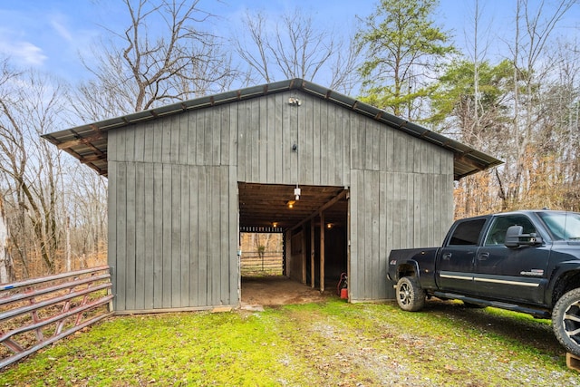 view of outbuilding featuring a lawn