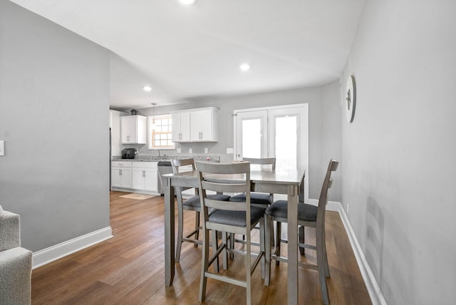 dining room with hardwood / wood-style floors