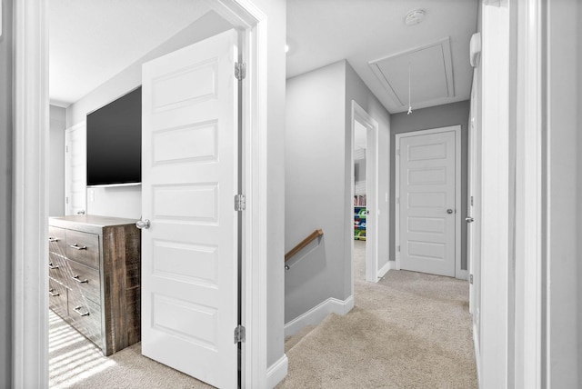 hallway featuring light colored carpet