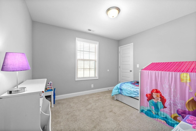 bedroom featuring light colored carpet