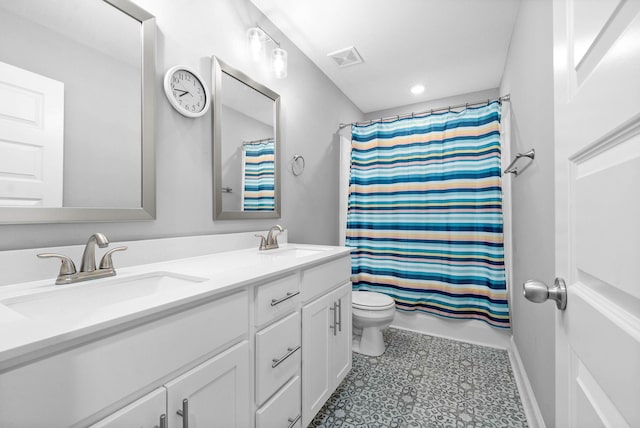 full bathroom with vanity, toilet, and shower / bath combo with shower curtain