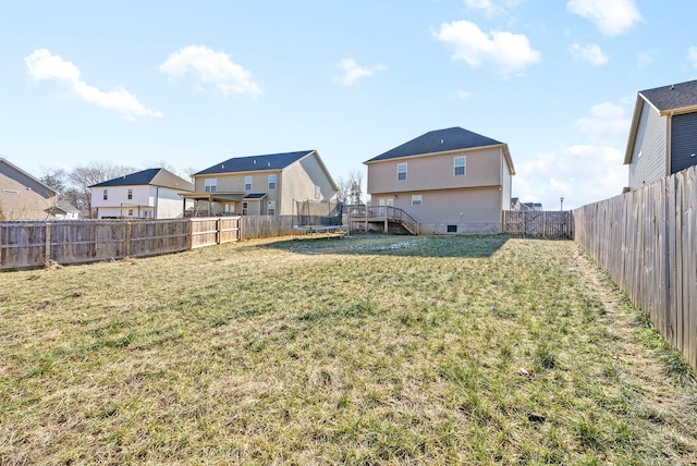 view of yard with a trampoline