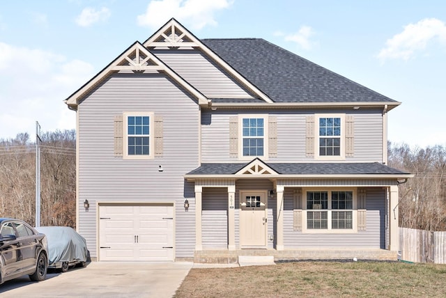 view of front of house featuring a garage and covered porch