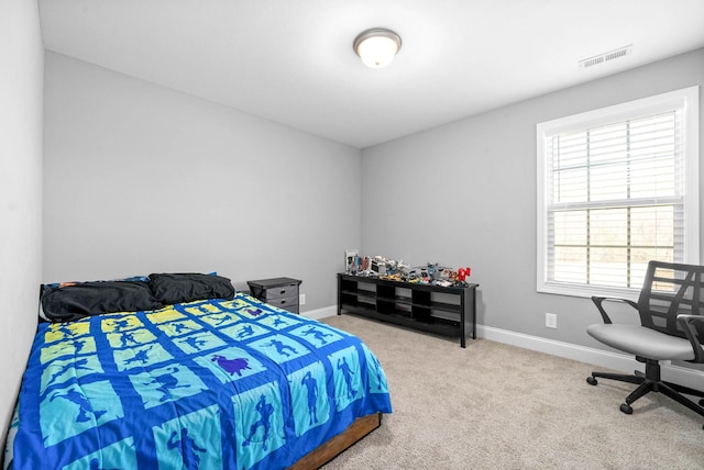 bedroom with light carpet