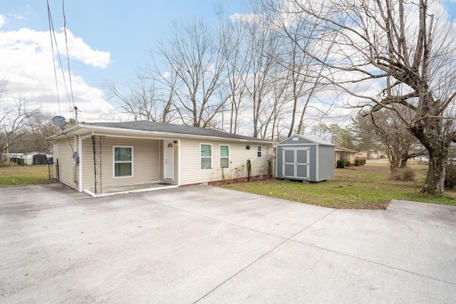 single story home with a storage unit and a front lawn