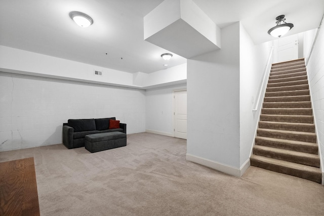 living area with light carpet