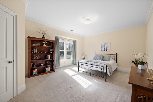 bedroom with crown molding and light carpet