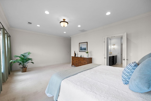 bedroom featuring crown molding, light colored carpet, and connected bathroom