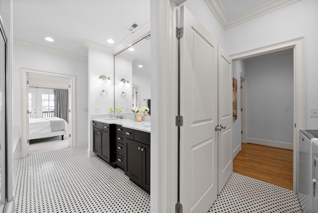 bathroom with vanity, hardwood / wood-style floors, and ornamental molding