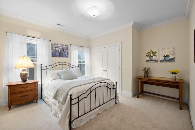 carpeted bedroom featuring crown molding and a closet