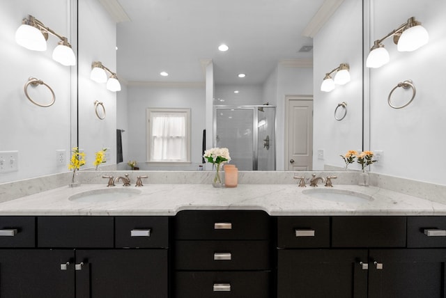 bathroom featuring walk in shower, ornamental molding, and vanity