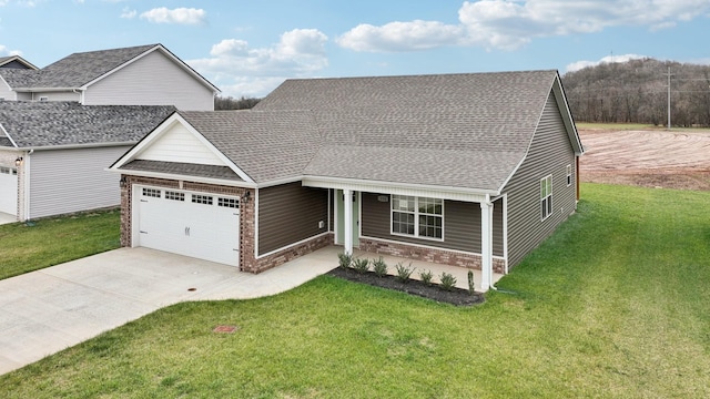 view of front facade with a garage, a porch, and a front yard