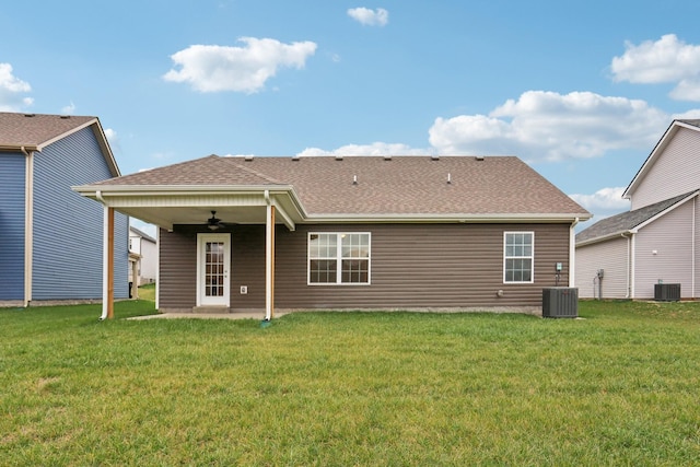 back of property featuring ceiling fan, a patio area, a lawn, and central air condition unit