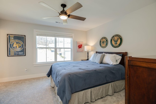 bedroom featuring ceiling fan and light carpet