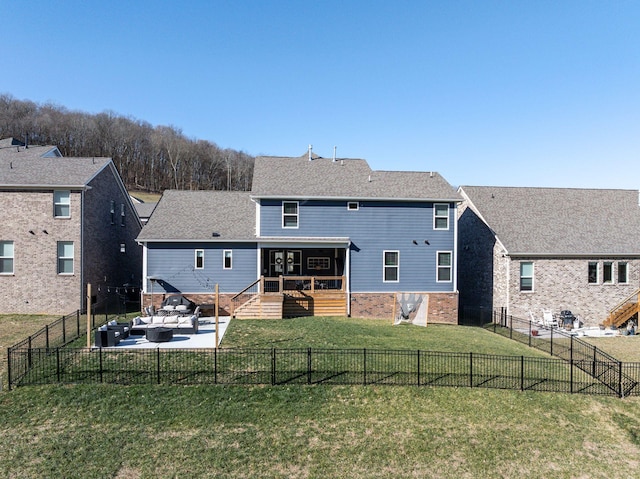 back of house featuring an outdoor living space, a patio, and a lawn