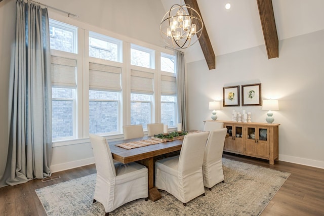 dining room with dark hardwood / wood-style flooring, plenty of natural light, vaulted ceiling with beams, and a chandelier