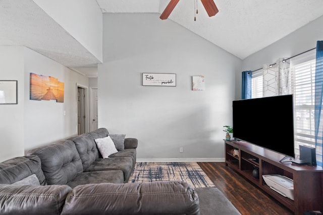 living room with vaulted ceiling, dark wood-type flooring, ceiling fan, and a textured ceiling