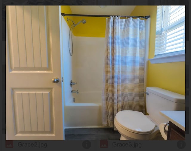 full bathroom with vanity, toilet, and shower / bath combo