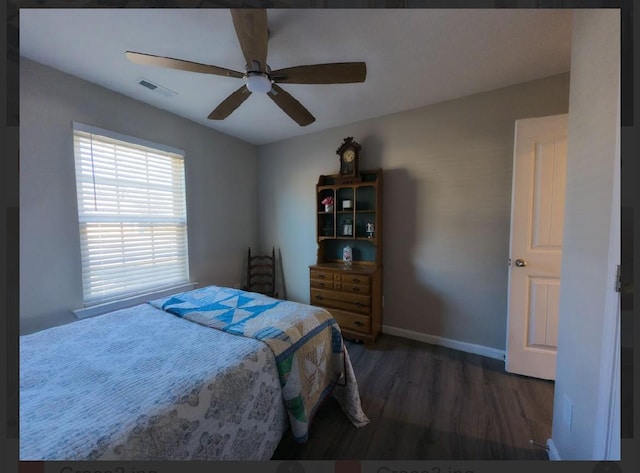 bedroom featuring dark hardwood / wood-style floors and ceiling fan