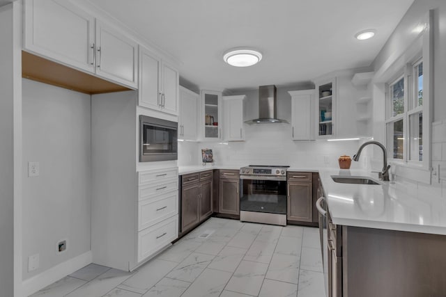 kitchen with wall chimney range hood, sink, white cabinetry, electric range, and black microwave