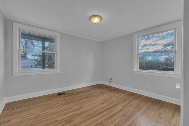 unfurnished room featuring light hardwood / wood-style flooring