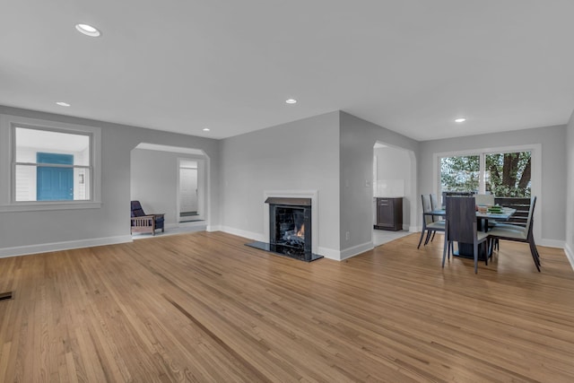 unfurnished living room featuring light hardwood / wood-style floors