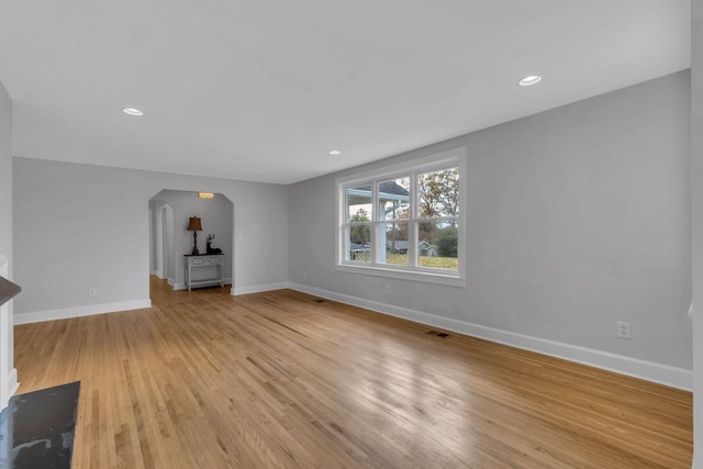 unfurnished living room with light hardwood / wood-style flooring