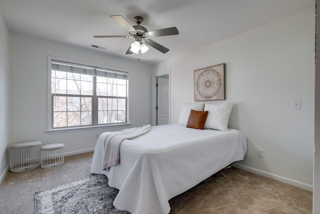 bedroom featuring light carpet and ceiling fan