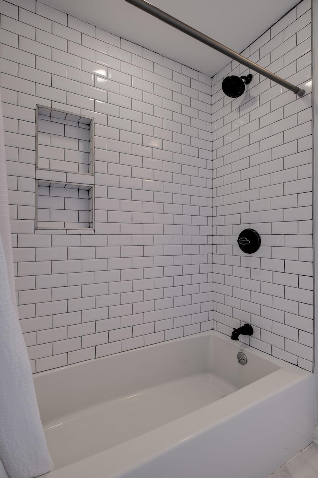 bathroom with shower / bathtub combination with curtain and tile patterned floors