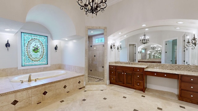 bathroom with vanity, a notable chandelier, and plus walk in shower