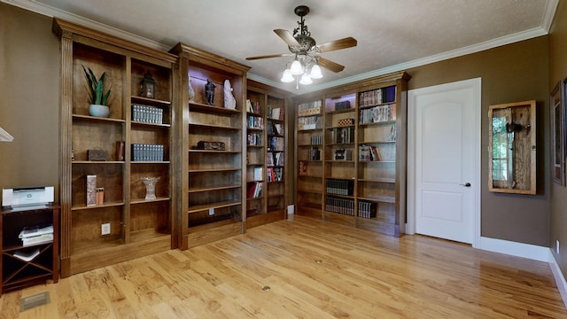 home office with ceiling fan, ornamental molding, and light hardwood / wood-style floors