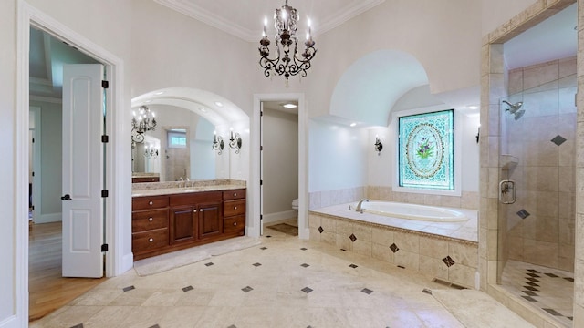 full bathroom featuring toilet, crown molding, a chandelier, vanity, and independent shower and bath