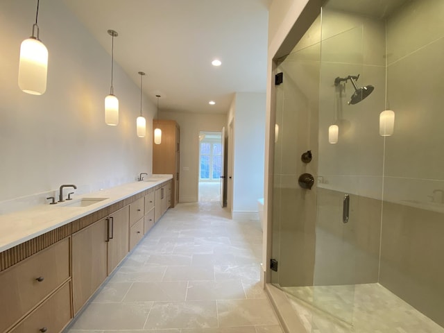 bathroom with vanity and walk in shower