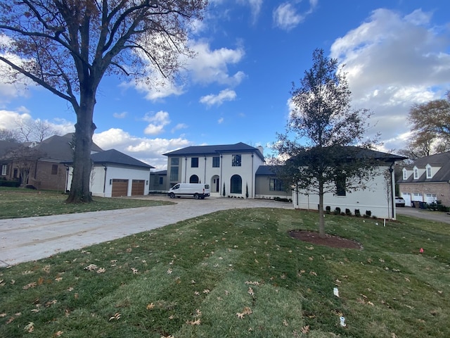 view of front facade with a garage and a front yard