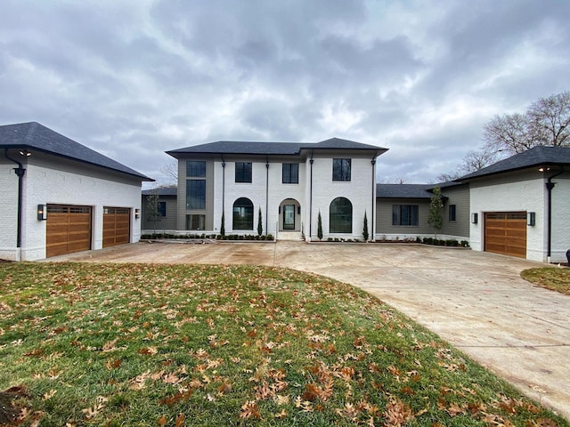 view of front of home with a garage and a front yard