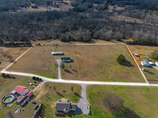 birds eye view of property with a rural view