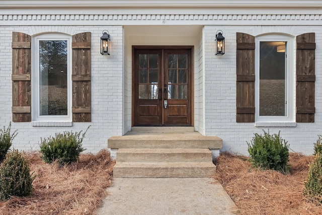 view of exterior entry featuring french doors