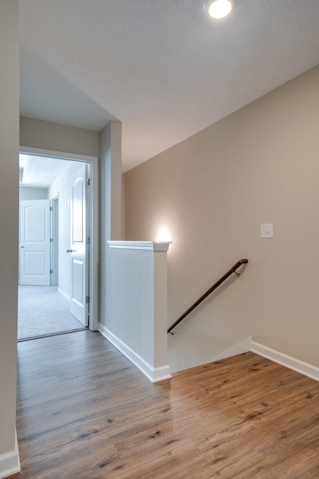 hallway featuring hardwood / wood-style floors