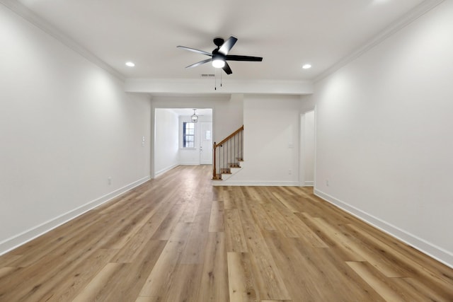 unfurnished living room featuring crown molding, ceiling fan, and light hardwood / wood-style floors