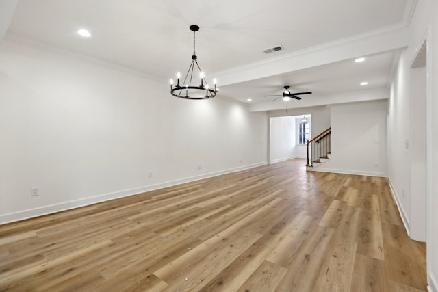 unfurnished living room with ceiling fan with notable chandelier, light hardwood / wood-style flooring, and ornamental molding