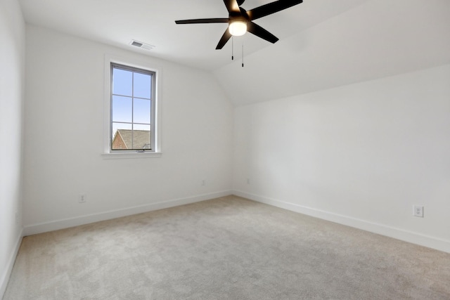 bonus room with ceiling fan, vaulted ceiling, and light carpet