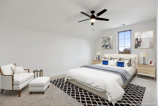 bedroom featuring light carpet, lofted ceiling, and ceiling fan